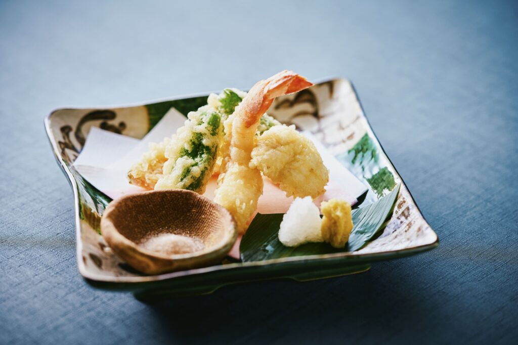 Japanese tempura with shrimp and seasonal vegetables served with salt and condiments