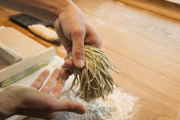 ready-cut soba in the chefs hands