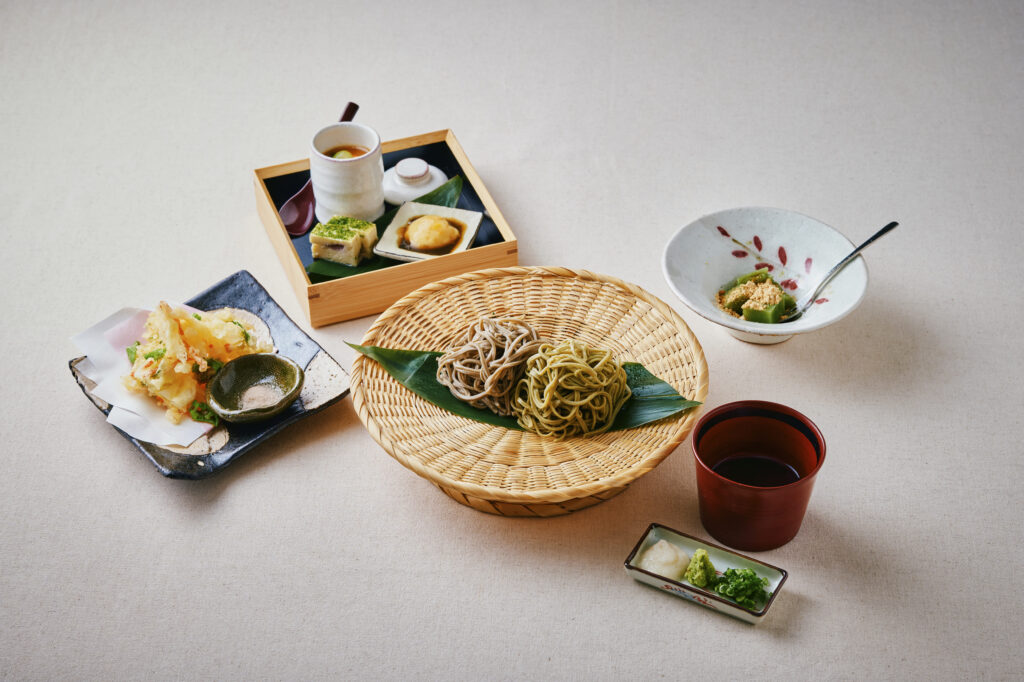 Traditional Japanese soba set meal with cold soba noodles, tempura, chawanmushi, and dipping sauce