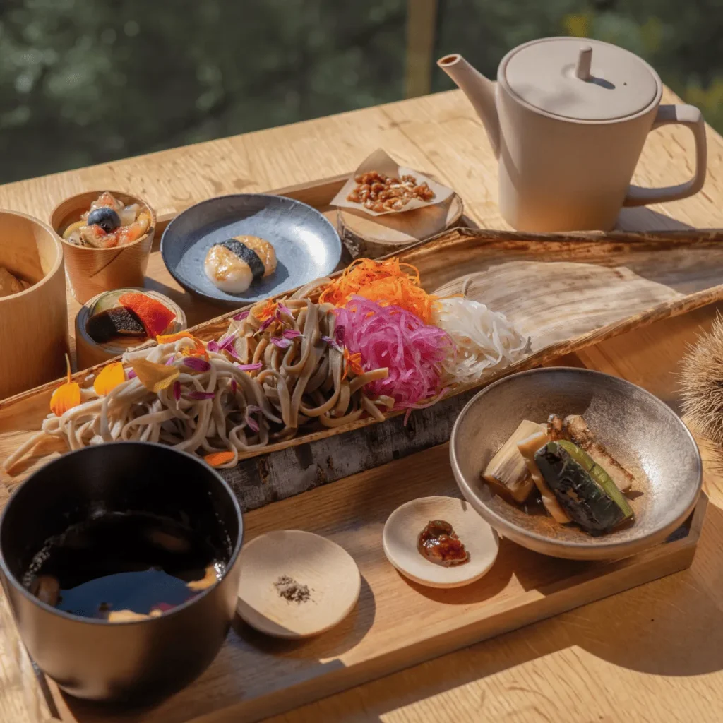 Colorful Japanese soba meal with seasonal vegetables and tea served at an Awaji Island Wellness & Zen Retreat.