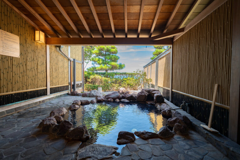 Private open-air hot spring bath in luxury Japanese ryokan on Awaji Island, natural onsen with ocean view for family-friendly wellness retreat in Luxury Japanese Ryokan with Private Onsen on Awaji Island