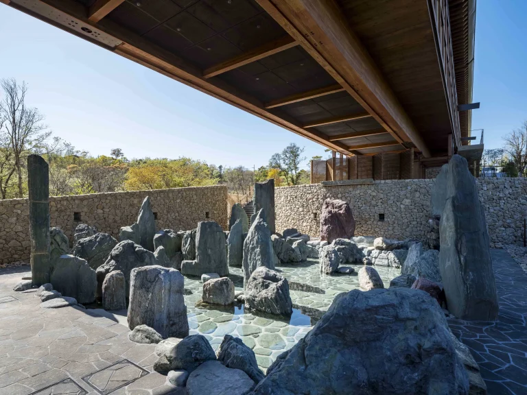 Outdoor Japanese footbath overlooking a Zen stone garden at an Awaji Island Wellness & Zen Retreat