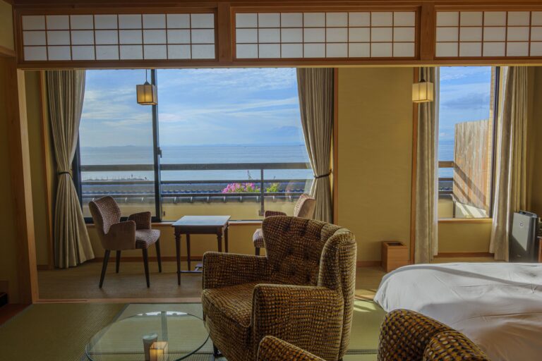 Ocean view from superior Japanese-style room at Senshin Waho ryokan overlooking the Seto Inland Sea with seating area and balcony
