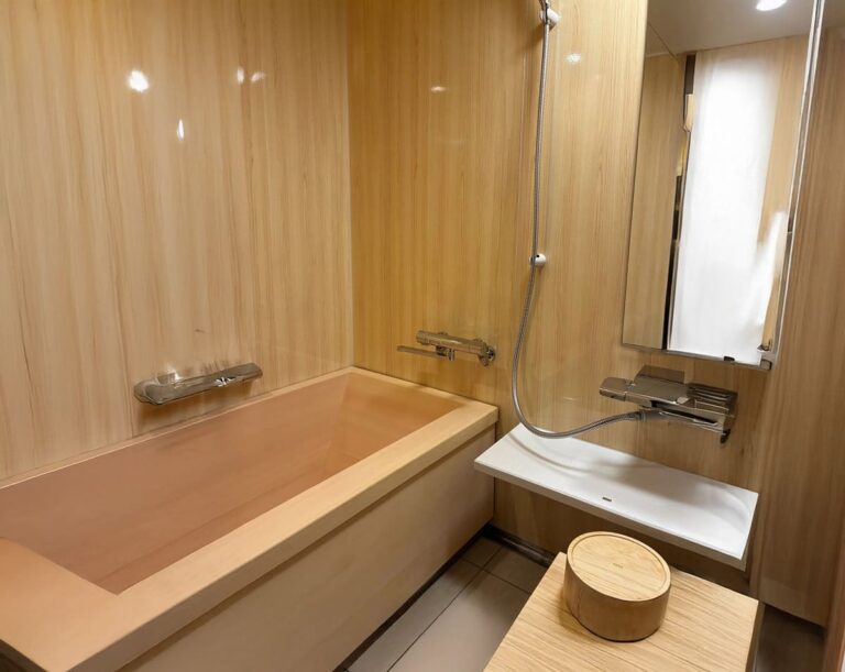 Cypress wood bath in superior room at Senshin Waho ryokan on Awaji Island, traditional Japanese-style bathing space with modern amenities